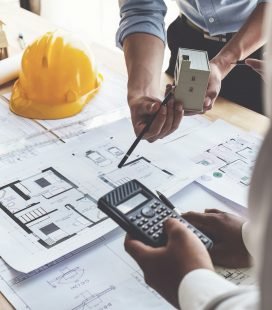 Architect team working with blueprints for architectural plan, engineer sketching a construction